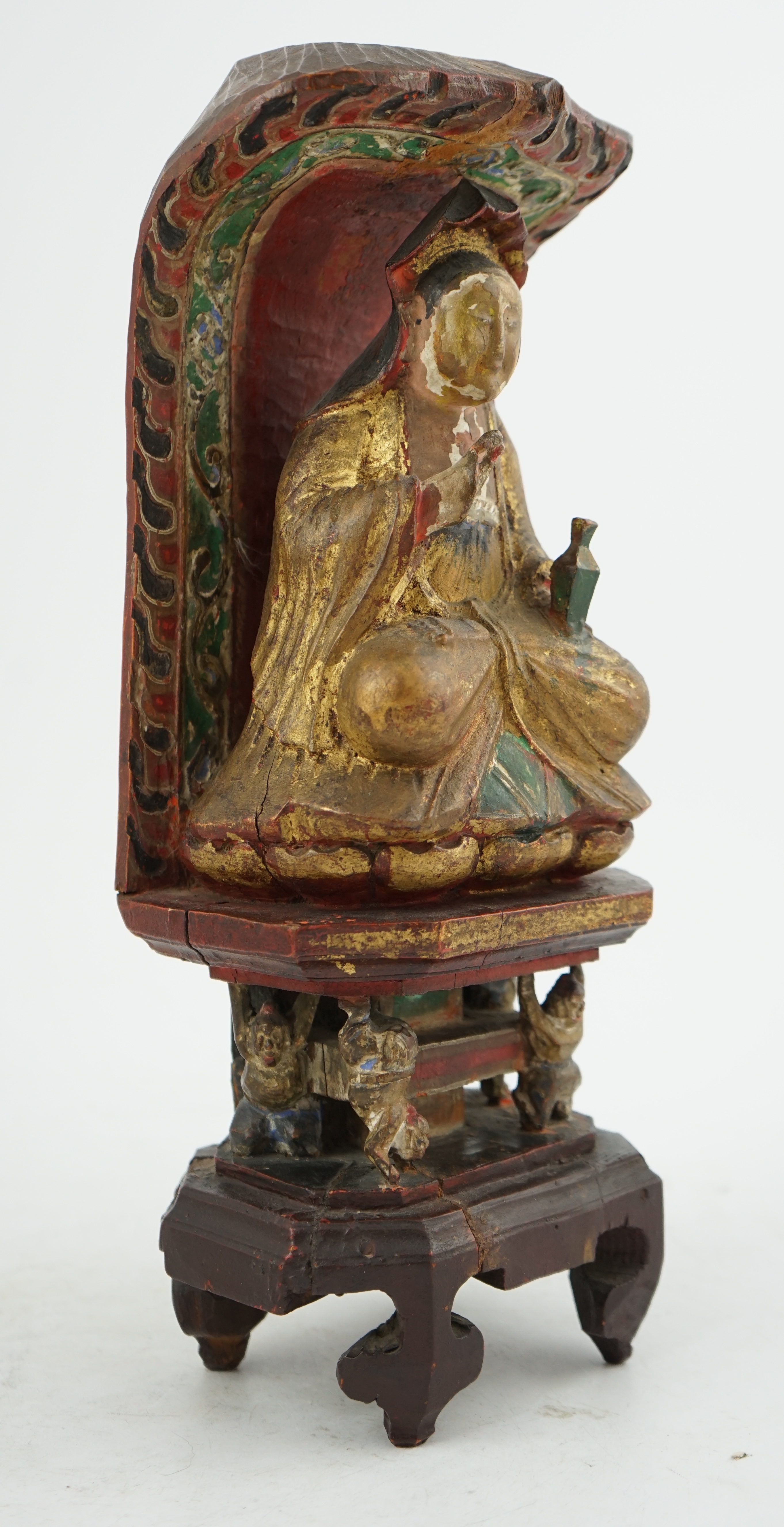 A Chinese polychrome and giltwood seated figure of Guanyin, Guangxu period inscription for the first year of his reign, c.1875